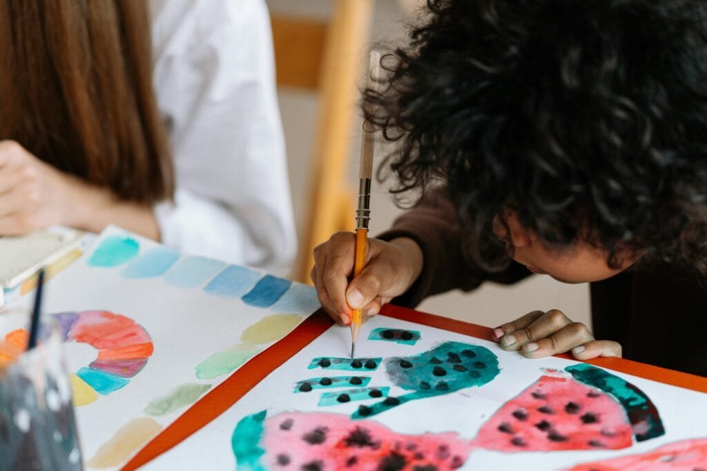 Little Boy Drawing and Painting Watermelons